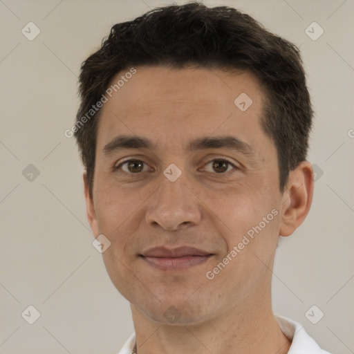 Joyful white adult male with short  brown hair and brown eyes