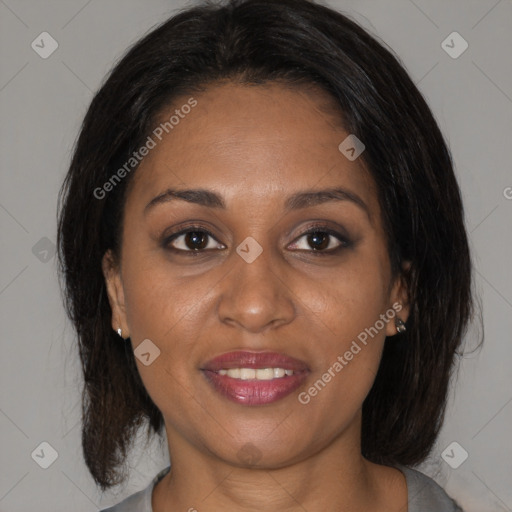 Joyful black young-adult female with medium  brown hair and brown eyes