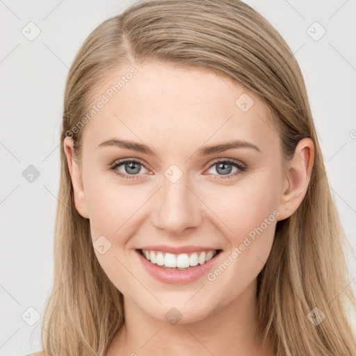 Joyful white young-adult female with long  brown hair and blue eyes