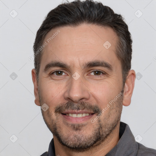 Joyful white adult male with short  brown hair and brown eyes