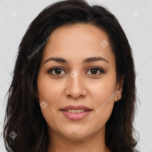 Joyful latino young-adult female with long  brown hair and brown eyes