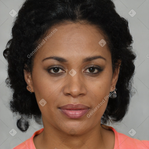 Joyful black adult female with medium  brown hair and brown eyes