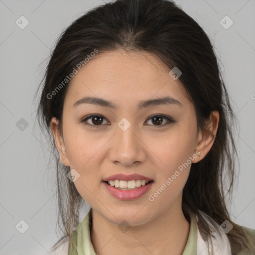 Joyful latino young-adult female with medium  brown hair and brown eyes