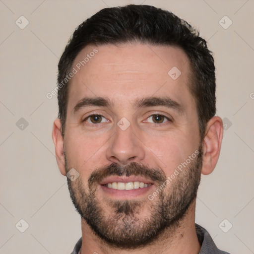 Joyful white young-adult male with short  black hair and brown eyes