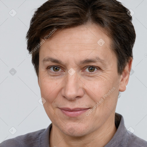 Joyful white adult female with short  brown hair and brown eyes