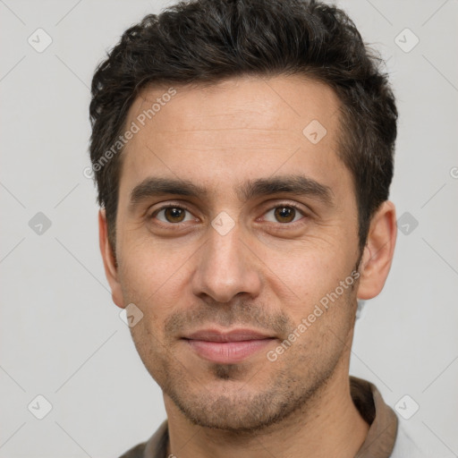 Joyful white adult male with short  brown hair and brown eyes