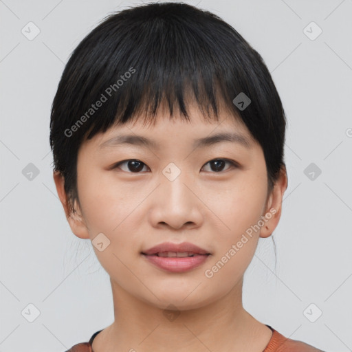 Joyful asian young-adult female with short  black hair and brown eyes