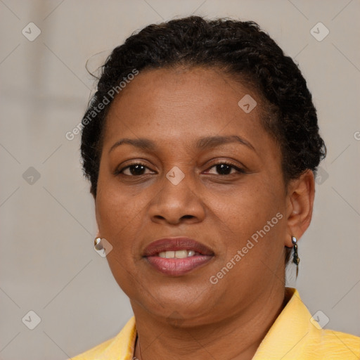 Joyful black adult female with short  brown hair and brown eyes