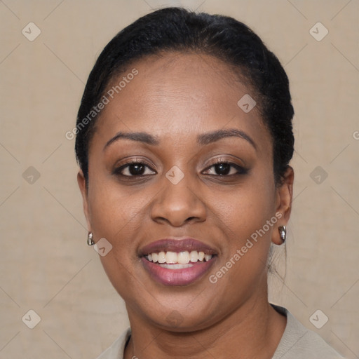 Joyful black young-adult female with short  brown hair and brown eyes