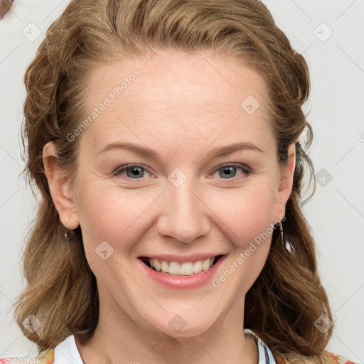 Joyful white young-adult female with long  brown hair and blue eyes