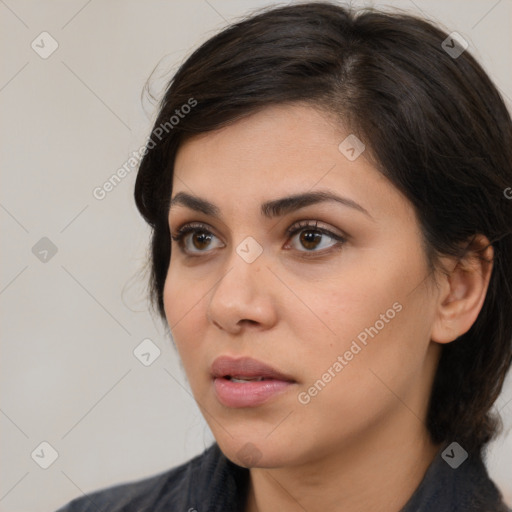 Neutral white young-adult female with medium  brown hair and brown eyes