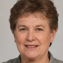 Joyful white middle-aged female with short  brown hair and brown eyes