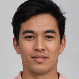 Joyful asian young-adult male with short  black hair and brown eyes