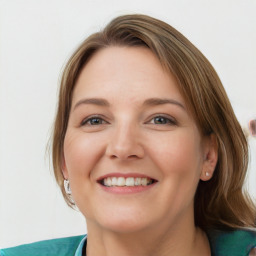 Joyful white young-adult female with medium  brown hair and blue eyes