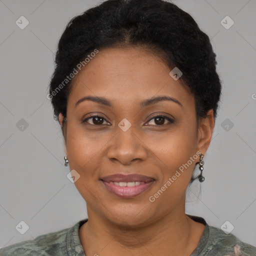 Joyful black adult female with short  brown hair and brown eyes