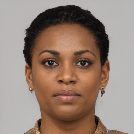 Neutral black young-adult female with short  brown hair and brown eyes