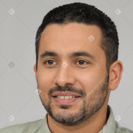 Joyful white young-adult male with short  black hair and brown eyes