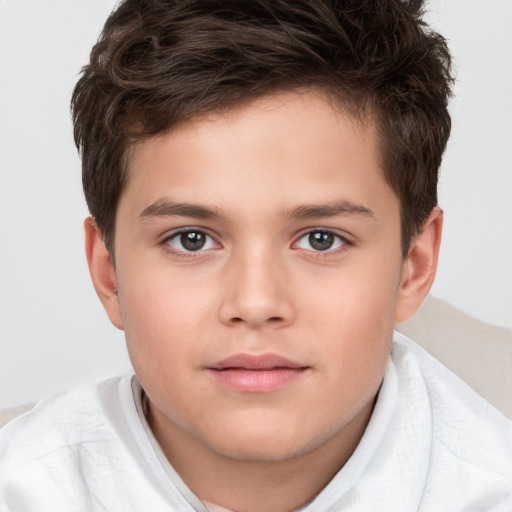 Joyful white child male with short  brown hair and brown eyes