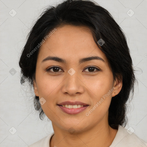 Joyful latino young-adult female with medium  brown hair and brown eyes