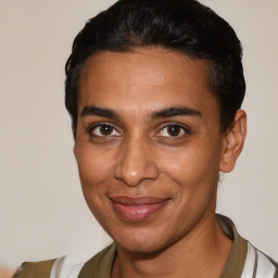 Joyful latino young-adult male with short  brown hair and brown eyes