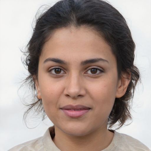 Joyful latino young-adult female with medium  brown hair and brown eyes