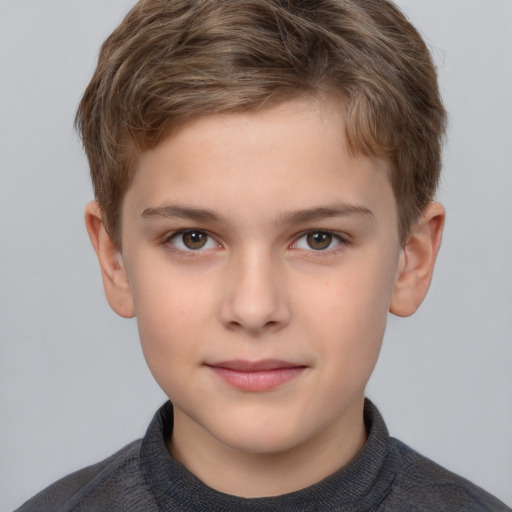 Joyful white child male with short  brown hair and brown eyes