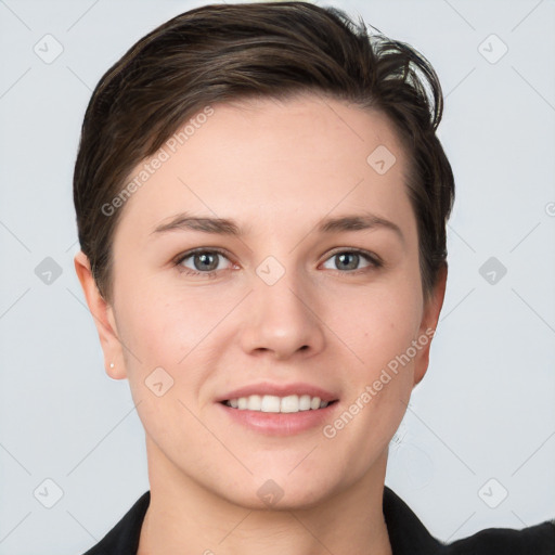 Joyful white young-adult female with short  brown hair and grey eyes