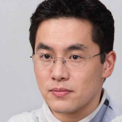 Neutral asian young-adult male with short  brown hair and brown eyes