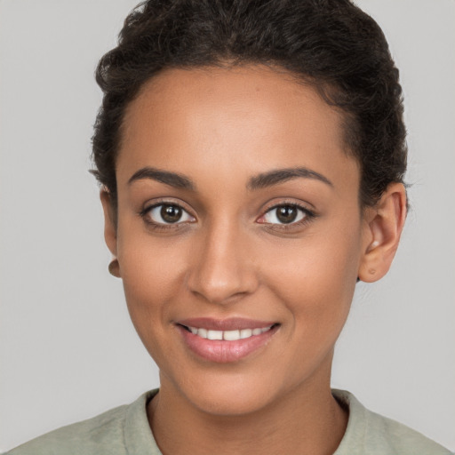 Joyful white young-adult female with short  brown hair and brown eyes