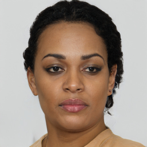 Neutral black young-adult female with short  black hair and brown eyes