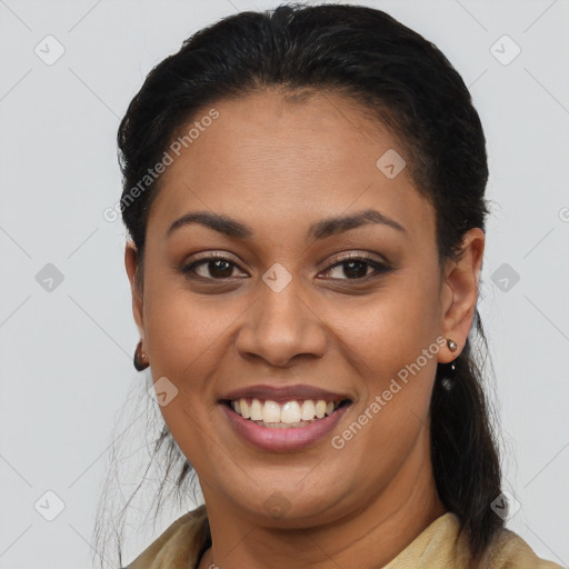 Joyful latino young-adult female with long  brown hair and brown eyes