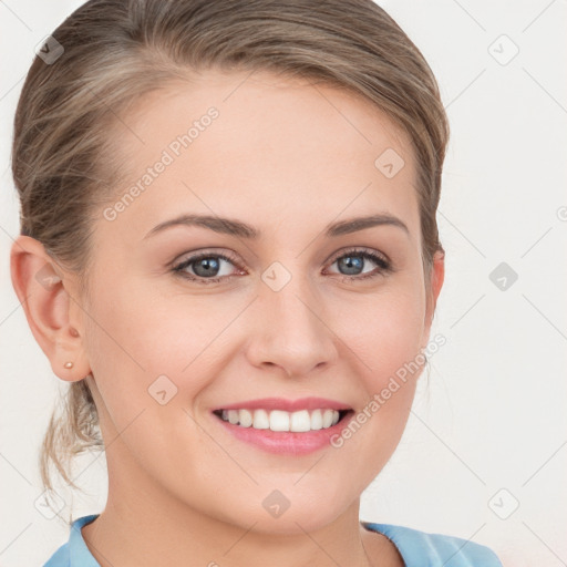 Joyful white young-adult female with medium  brown hair and blue eyes