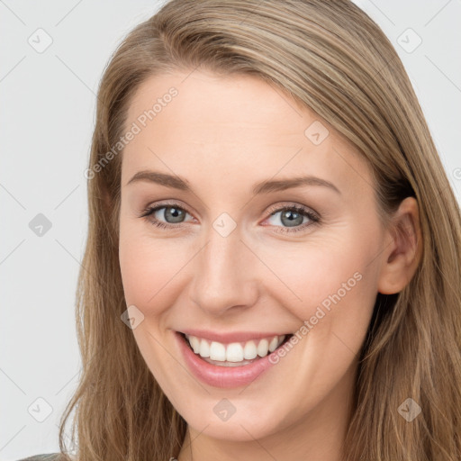 Joyful white young-adult female with long  brown hair and grey eyes