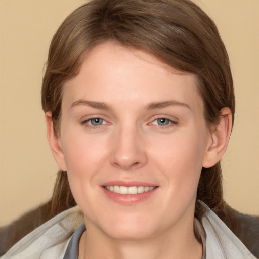 Joyful white young-adult female with medium  brown hair and brown eyes