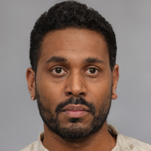 Neutral black young-adult male with short  black hair and brown eyes