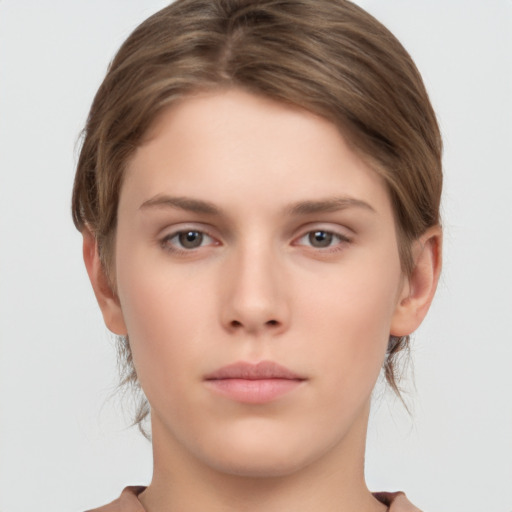 Neutral white young-adult female with short  brown hair and brown eyes