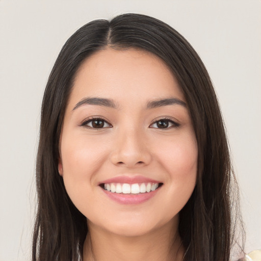 Joyful white young-adult female with long  brown hair and brown eyes