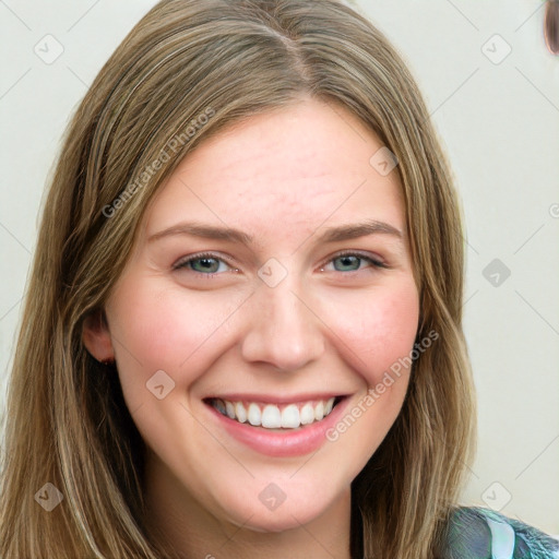 Joyful white young-adult female with long  brown hair and blue eyes