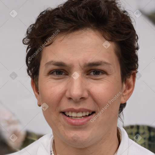 Joyful white adult female with short  brown hair and brown eyes