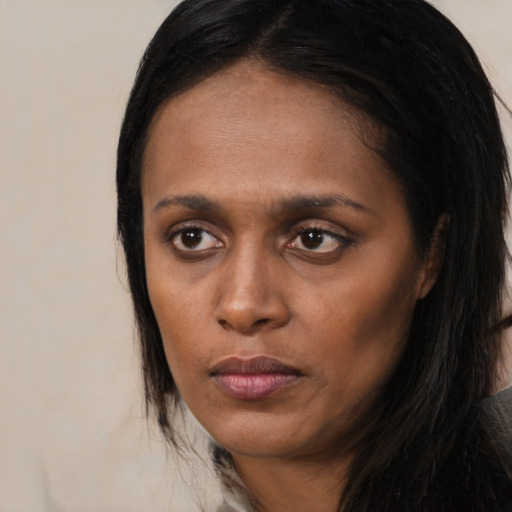 Neutral black young-adult female with long  black hair and brown eyes
