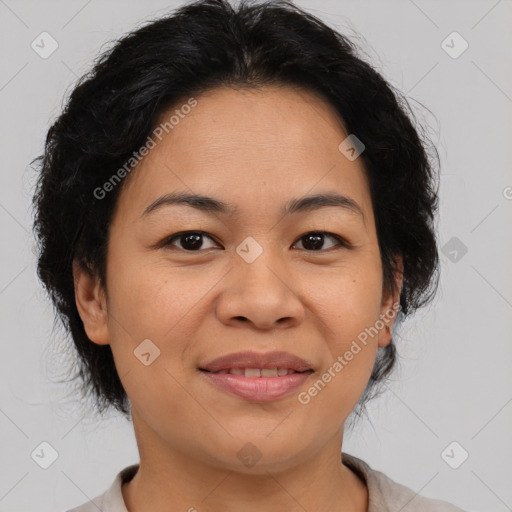 Joyful asian adult female with medium  brown hair and brown eyes