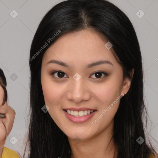 Joyful latino young-adult female with long  brown hair and brown eyes