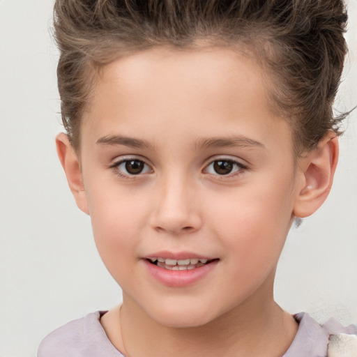 Joyful white child female with short  brown hair and brown eyes