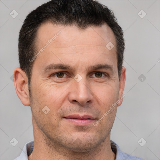 Joyful white adult male with short  brown hair and brown eyes