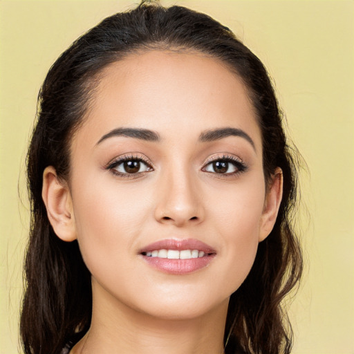 Joyful white young-adult female with long  brown hair and brown eyes