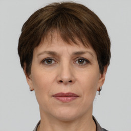 Joyful white adult female with short  brown hair and brown eyes