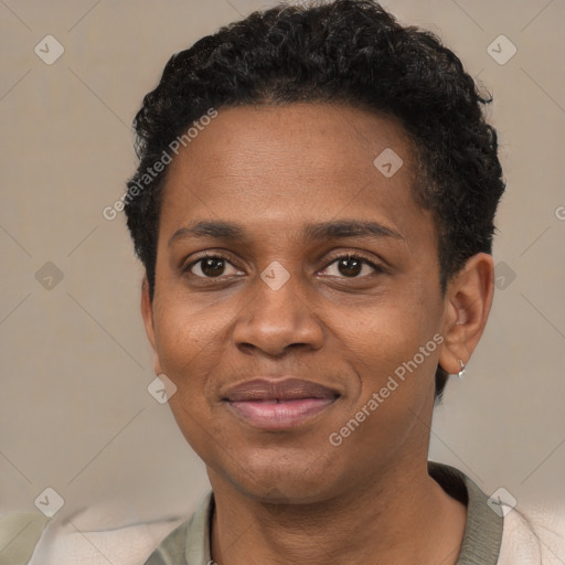 Joyful black adult female with short  black hair and brown eyes