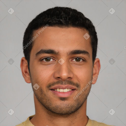 Joyful latino young-adult male with short  brown hair and brown eyes