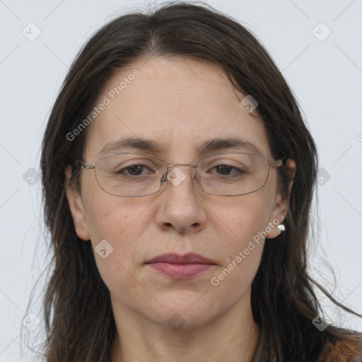 Joyful white adult female with long  brown hair and brown eyes