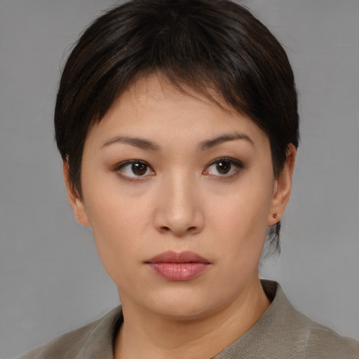 Neutral asian young-adult female with medium  brown hair and brown eyes